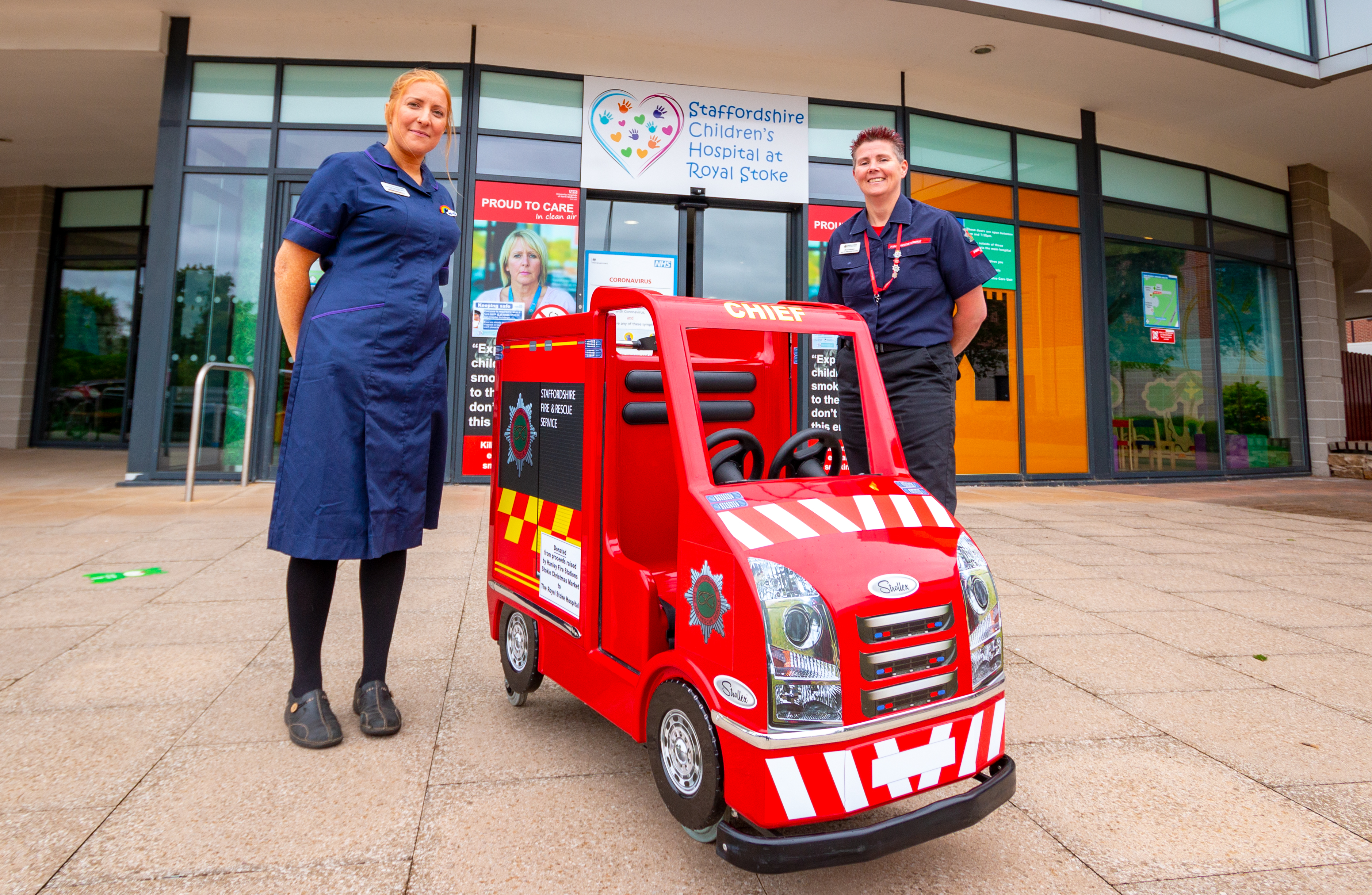 Kids mini fire engine outside hospital