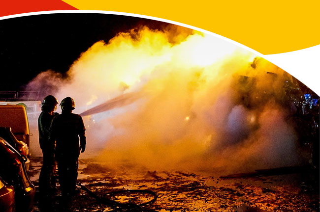 Firefighters hosing down fire