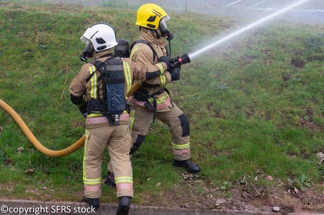 Two firefighters with hose