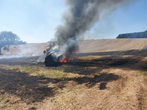 Combine harvester on fire
